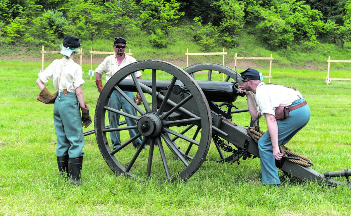 One of the 3rd U.S. Infantry gun crews prepares to fire their 3-inch ordnance rifle.