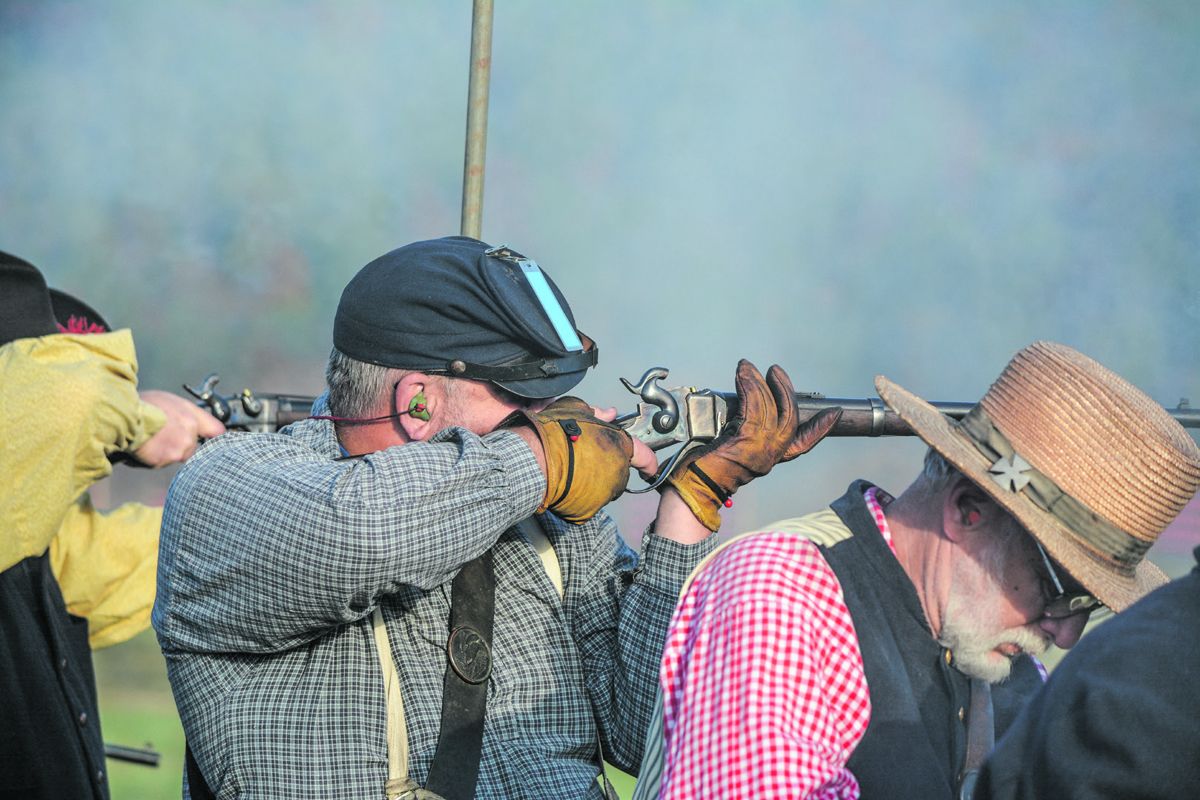 Carbine shooters aim and prepare to fire at targets down range. 134 member teams competed in the 140th N-SSA National Skirmish carbine team match.