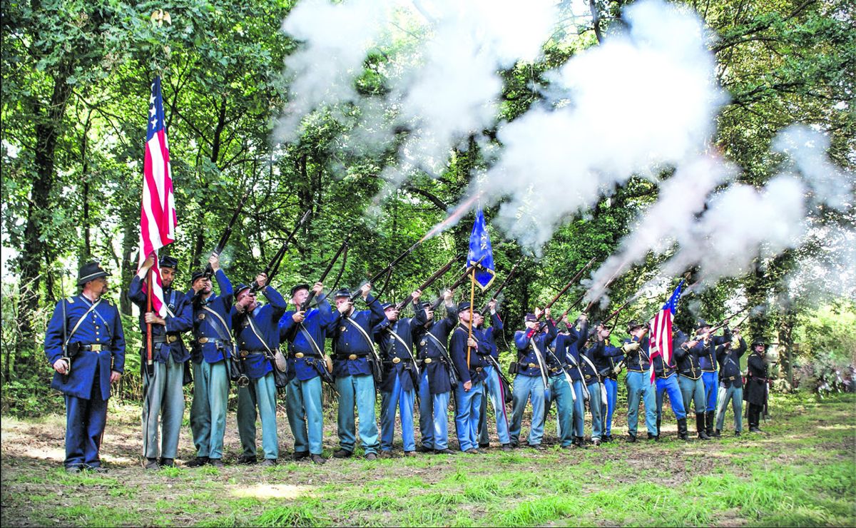 Federal reenactors fire a salute during a ceremony to honor Heros von Borcke.