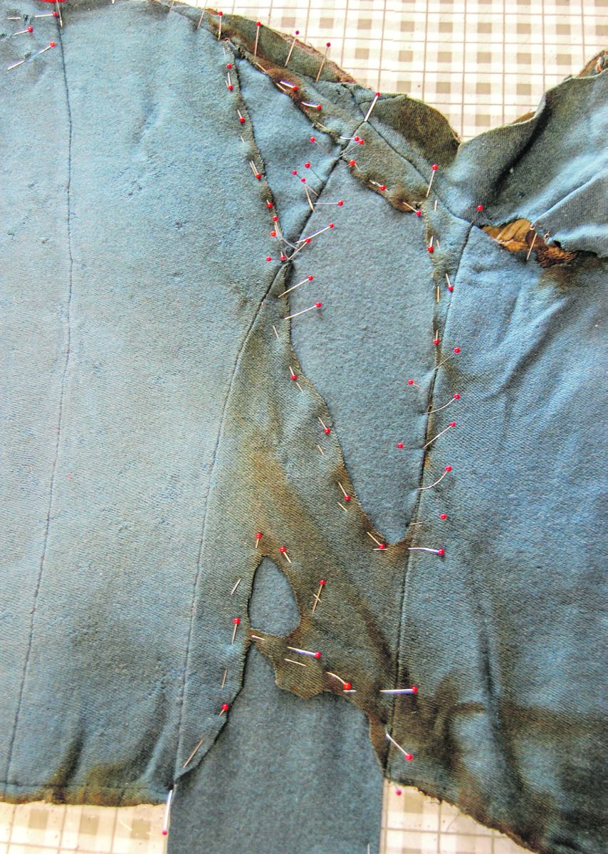 New wool panels, inset into damage areas, before stitching to back of coat.