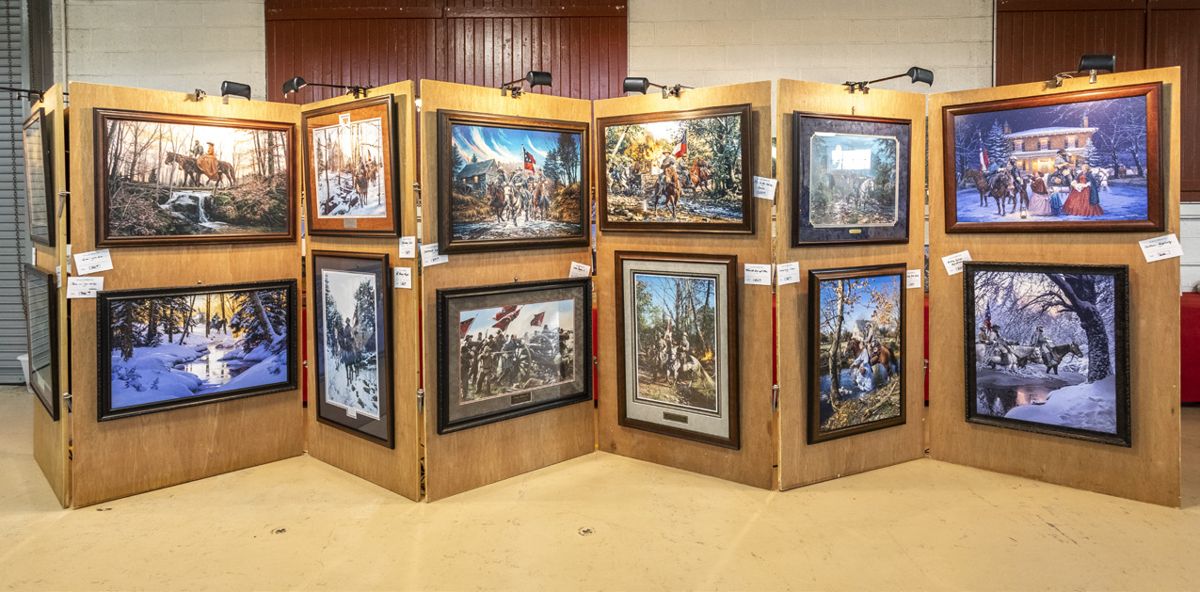 Debi and Kent Robinson added some pizazz to the show with prints by John Paul Strain.