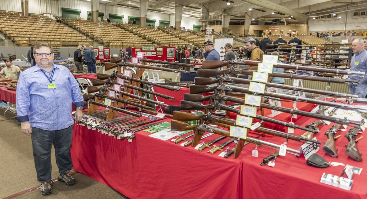 Tim Prince of College Hill Arsenal with a stunning array of Civil War long guns and bayonets.