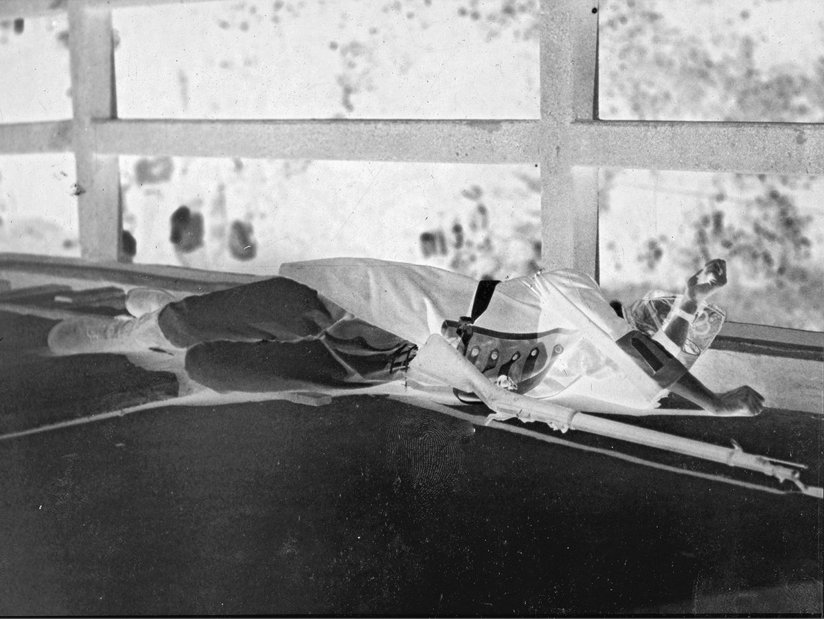 A British casualty, actually a Mass. National Guardsman, lies on Concord Bridge in 1930, his Model 1873 Springfield by his (Joseph Bilby Collection)