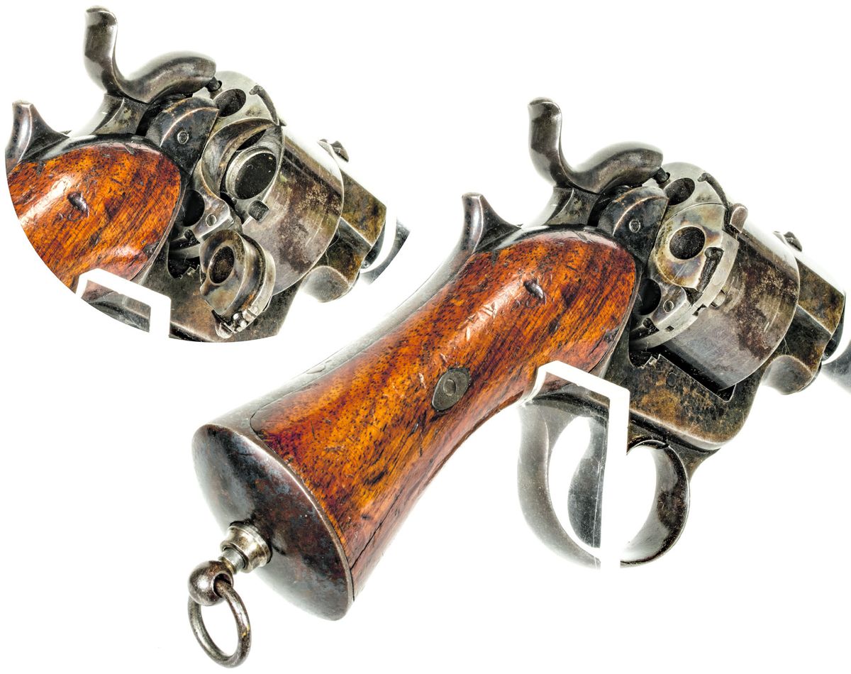 Rear of the Raphael revolver cylinder with the hammer nose in the blind “safety” hole. Inset shows the loading gate open, and the cylinder freed to rotate separately from the back plate.