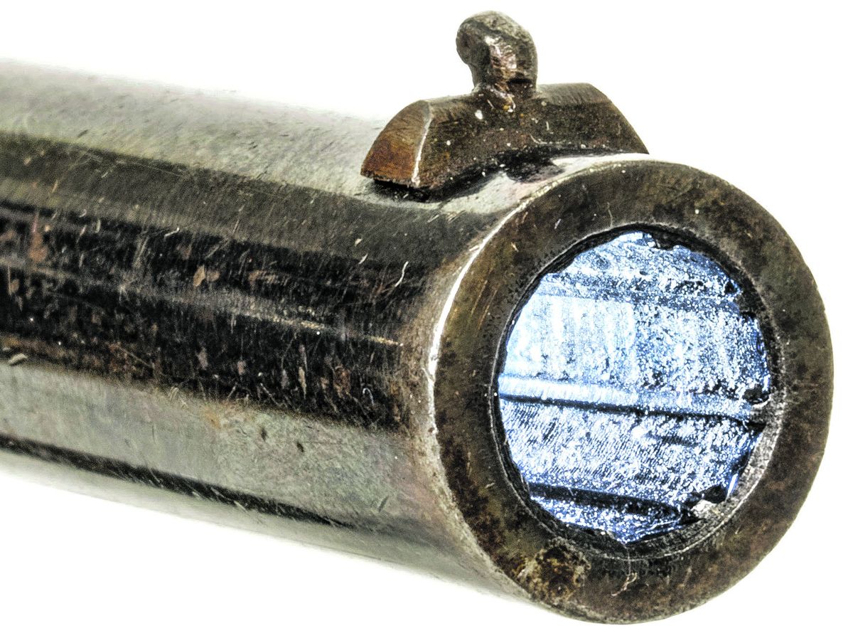 narrow, 8-groove rifling and the front sight.