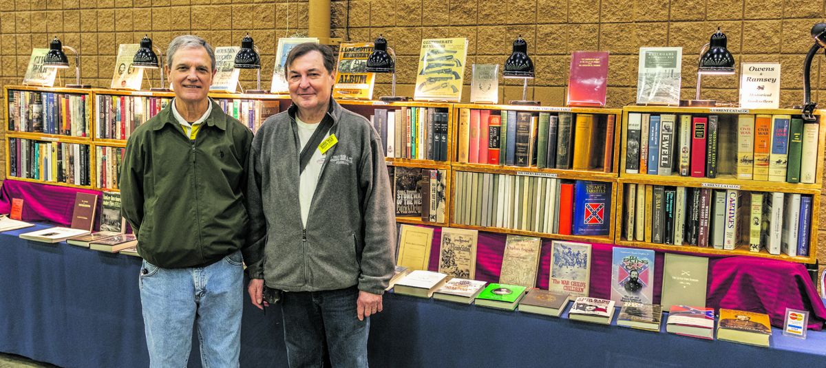 Show promoter Mike Kent and Marc Ramsey, owner of Owens and Ramsey Booksellers pose for a quick photo.