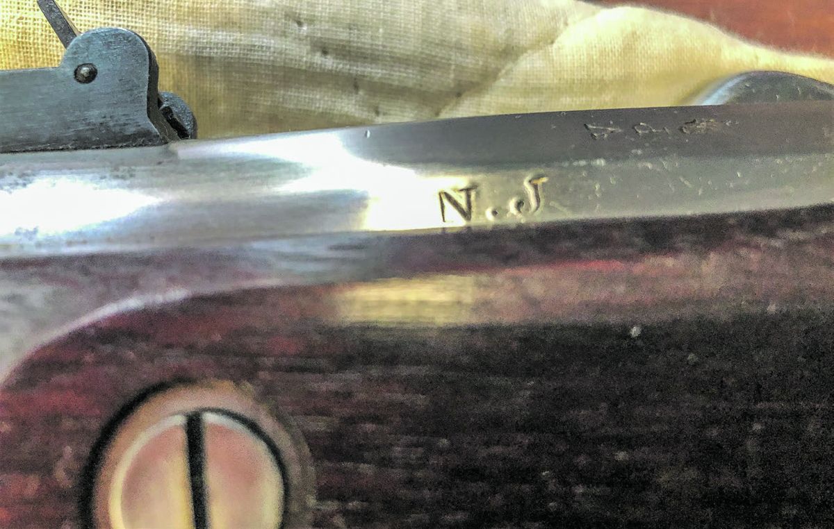 NJ marking on barrel breech, obverse side.