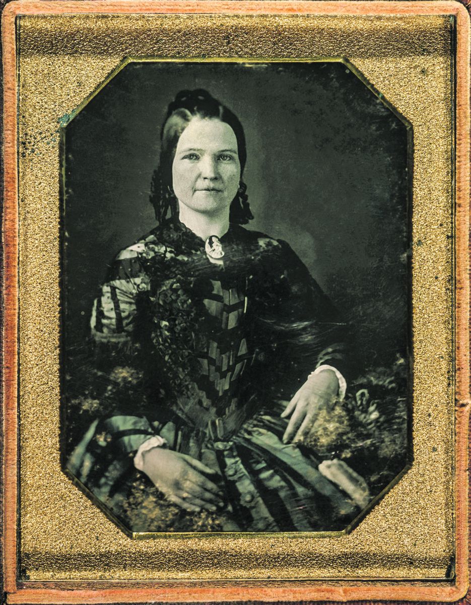 Mary Todd Lincoln, wife of Abraham Lincoln. Three-quarter length portrait, seated, facing front. Attribution to Nicolas H. Shepherd based on similarity to daguerreotype of Lincoln received as a pair with this portrait. Photograph was taken in 1846 or 1847.