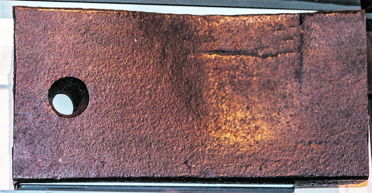 Portion of two-inch thick iron plate from the casemate of the CSS Virginia on display inside the Mariner’s Museum. Note the projectile impact damage on the iron plate caused by one of the shots from the USS Monitor.