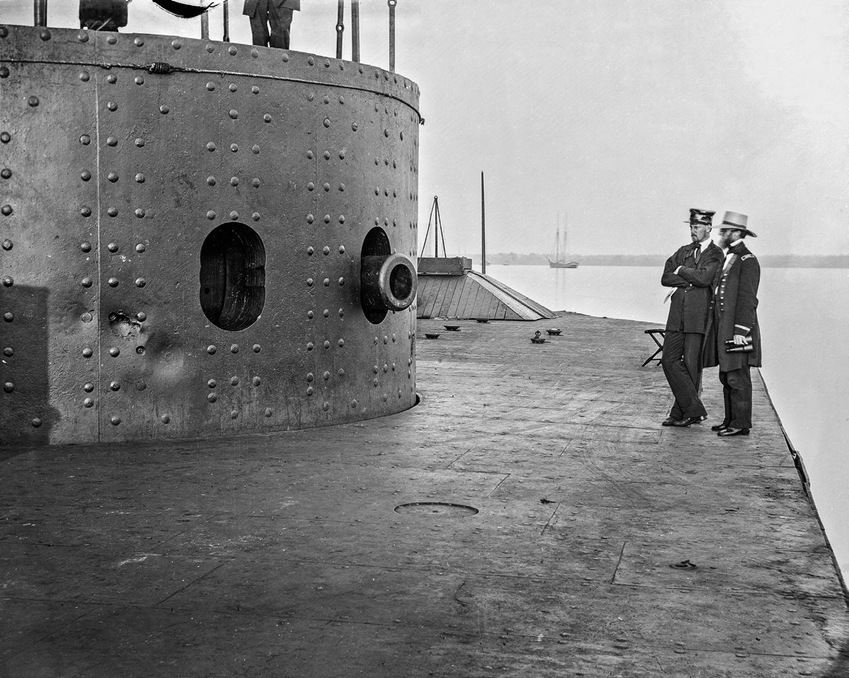 Projectile damage on the Monitor’s turret caused by shots fired from the CSS Virginia the day after sinking the USS Cumberland. This damage occurred during the famous Battle of Hampton Roads on March 9, 1862, the first battle between two ironclad warships. Note the close proximity of at least three impressions from projectiles fired at the gun ports.