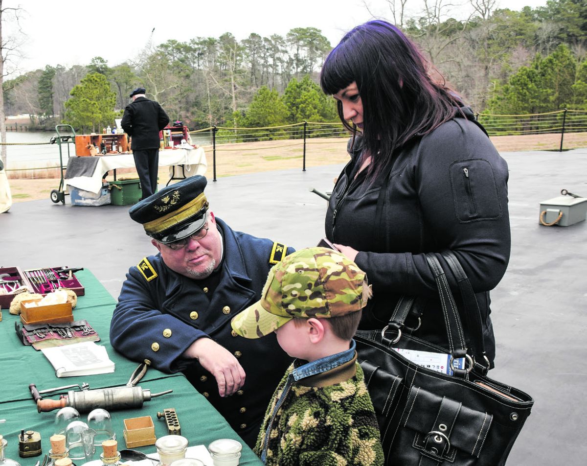 Interpreter Chris Grimes shared his knowledge of shipboard medical services with visitors. (Bob Ruegsegger)