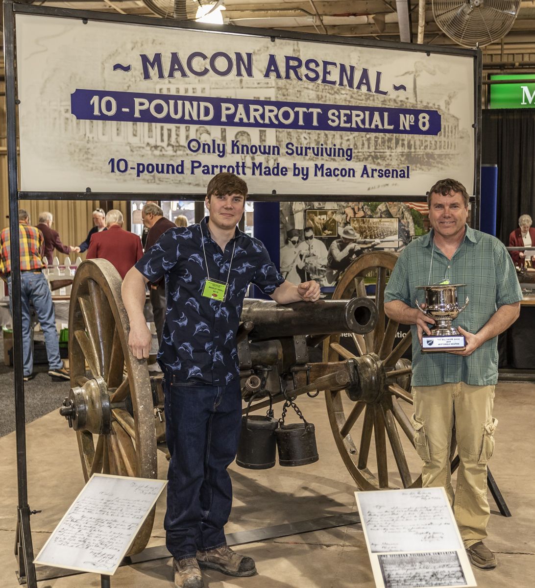 Best Weapon Award went to Ken Knoll (right) for his Macon Arsenal 10-pounder Parrott rifle, Serial No. 8. Standing to his right is his son Bradley.