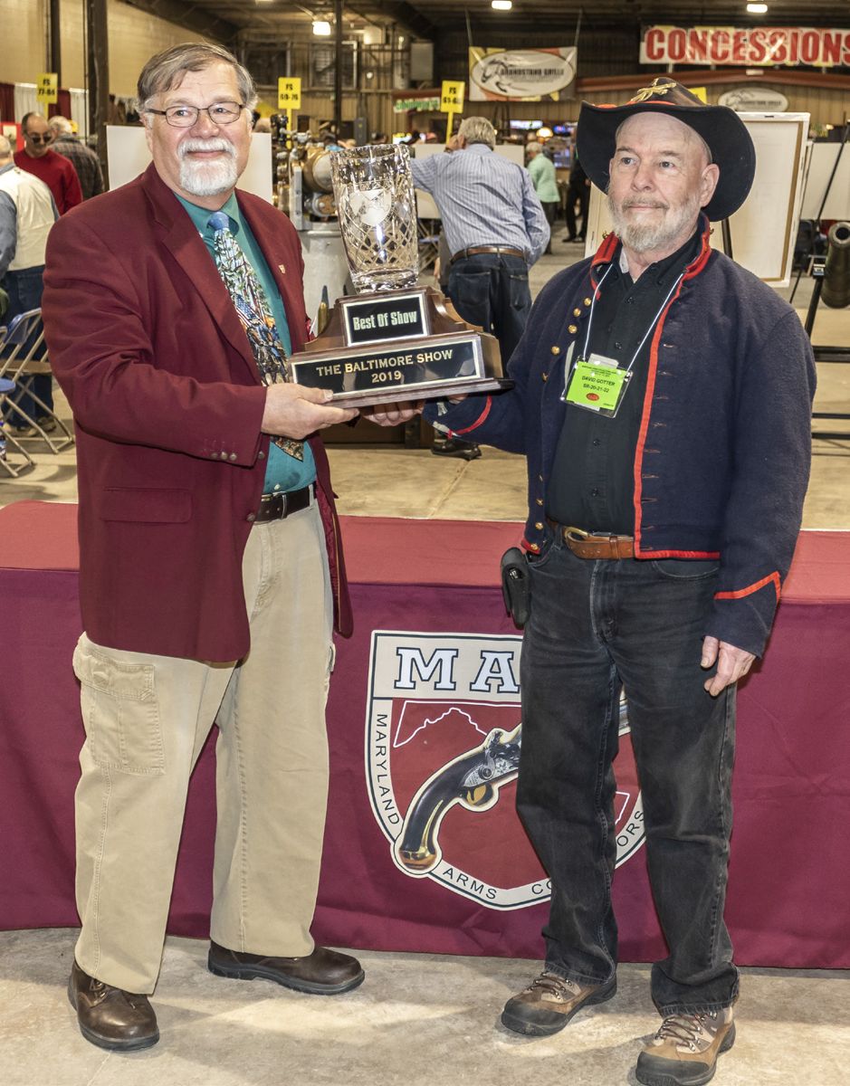 Maryland Arms Collectors Association, Inc. President Dave Booz presenting David Gotter the Best of Show trophy.