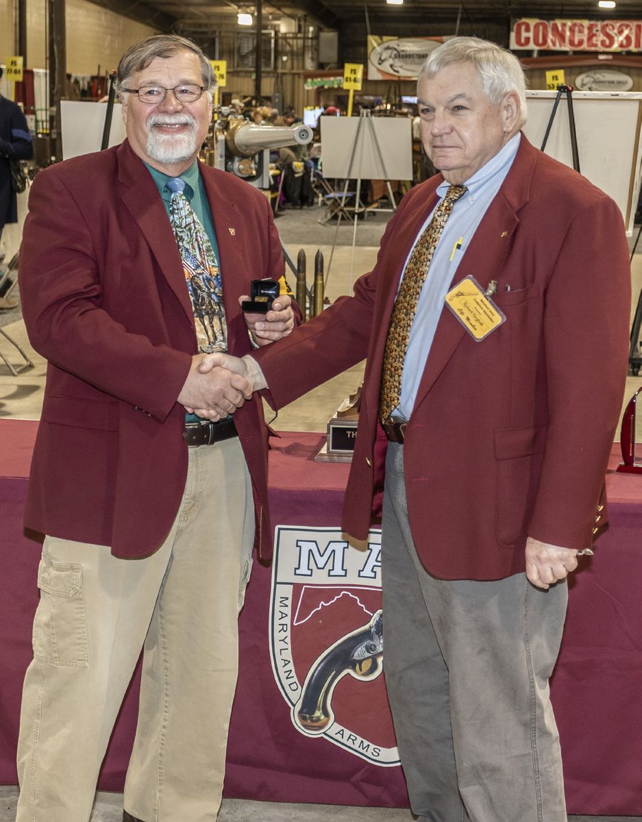 Dick Berglund receiving his 50 year pin from President Dave Booz.