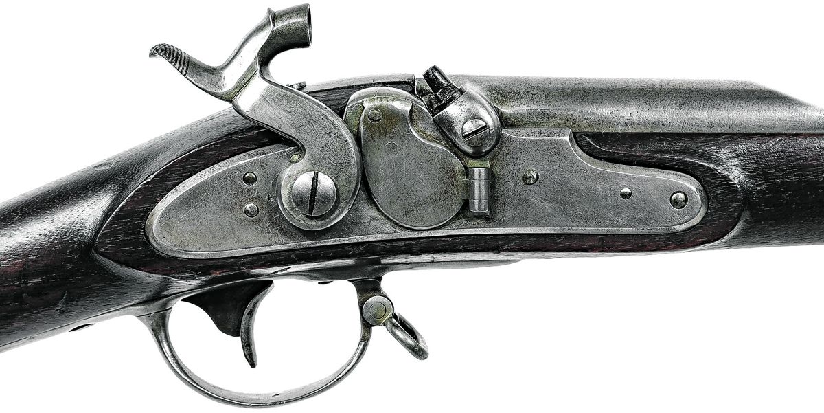Altered lock of the City of Philadelphia musket, showing the pinned and welded tape primer door with ground down “hump” and lack of markings.