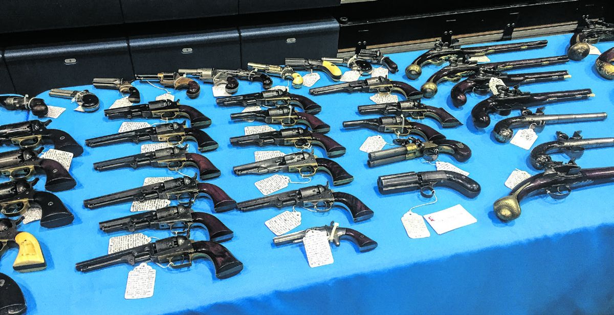 Vin Caponi’s table featured a variety of antique handguns, carbines, and other firearms for sale.