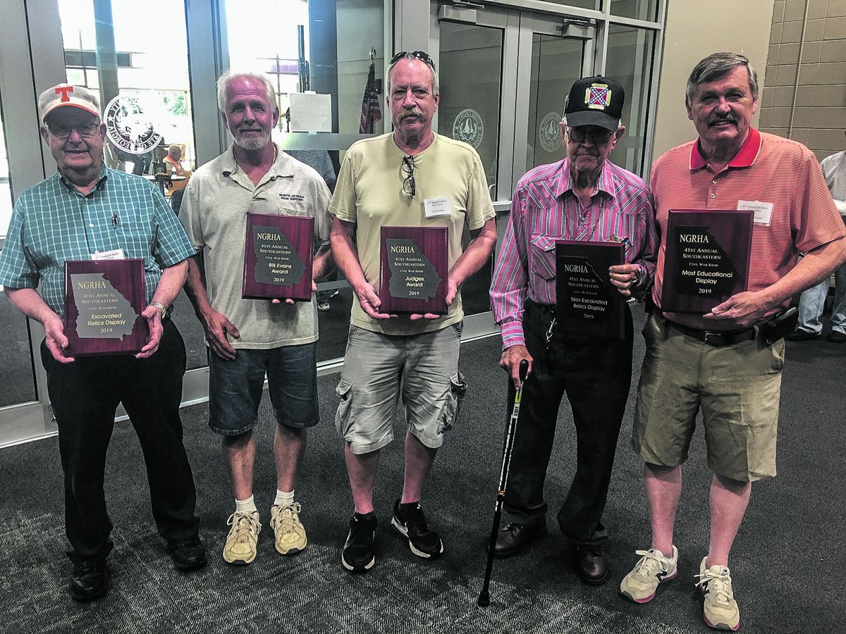 Left to right: Jerry Hayes won “Excavated Relics Display” for his Excavated Confederate Buckles and Buttons presentation. Stan Wills (not shown) and Roy Baker won “Bobby Westbrook / Bill Evans Display” for his locally dug relics exhibit. Scott Riddle won “Judges Award” for his Atlanta Campaign Relics display. John Turner won “Non-Excavated Relic Display” for his snake buckle exhibit, and Jerry Kirkland won “Most Educational Display” for his South Carolina Brass.