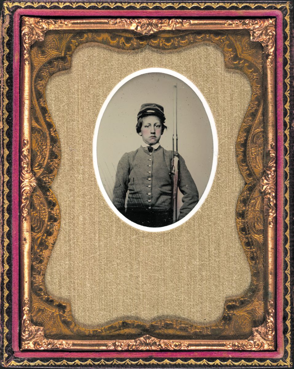 Unidentified soldier in Confederate uniform with Merrill carbine. (Liljenquist Family Collection of Civil War Photographs, Library of Congress) Two unidentified soldiers with Spencer carbines, 1860 sabers, and Colt Army revolvers, probably Union uniforms.
