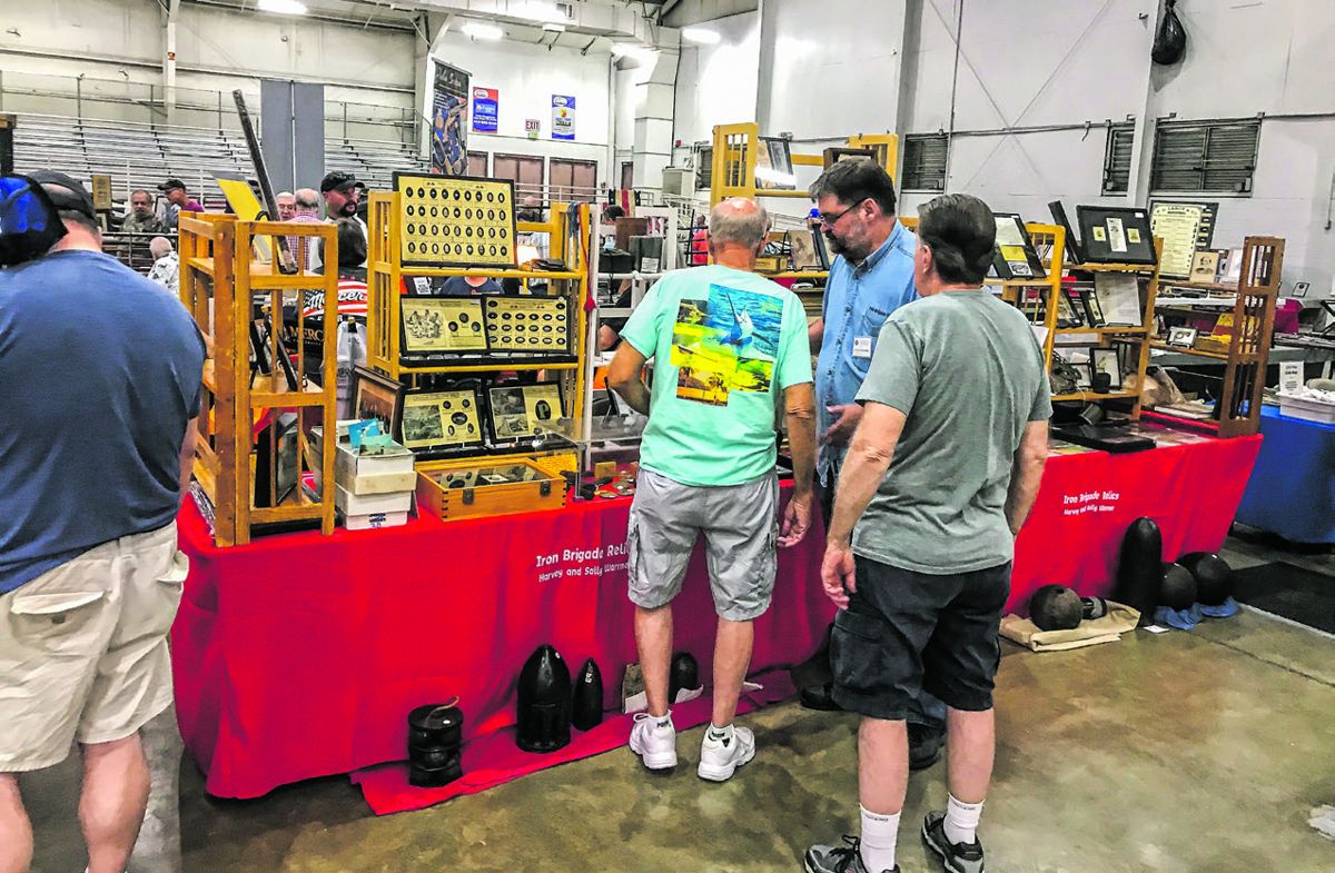 Harvey Warrner talks with customers about his Civil War relics.