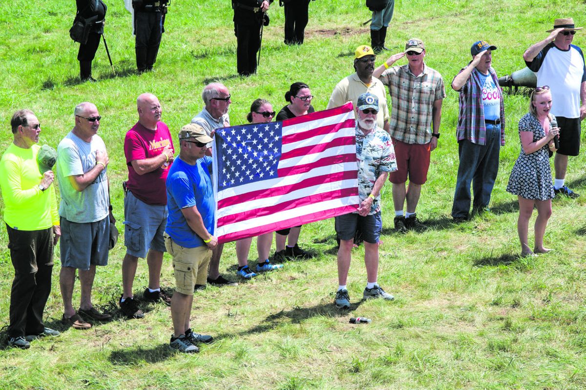 Military veterans being recognized before the battle begins.