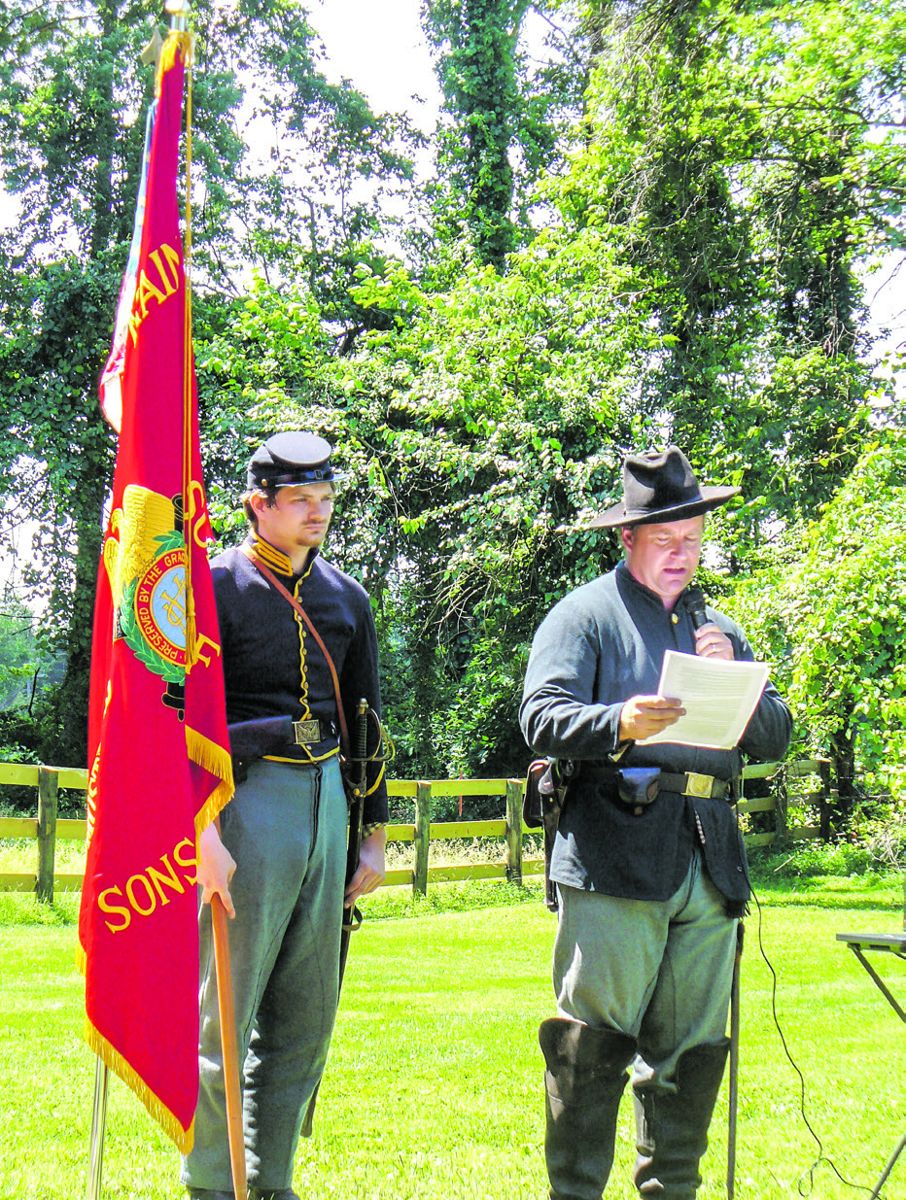 Tom Craig, of the 1st Maine Cavalry reenacting group, relates the history of the 1st Maine during the fighting at Middleburg. Caleb Horton stands to his left. (Joe Bordonaro)
