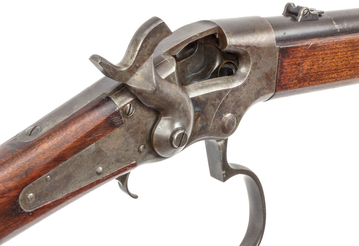 View of the Ball carbine with lever lowered, showing the action open, and the loading access through the receiver to the tubular under barrel magazine.