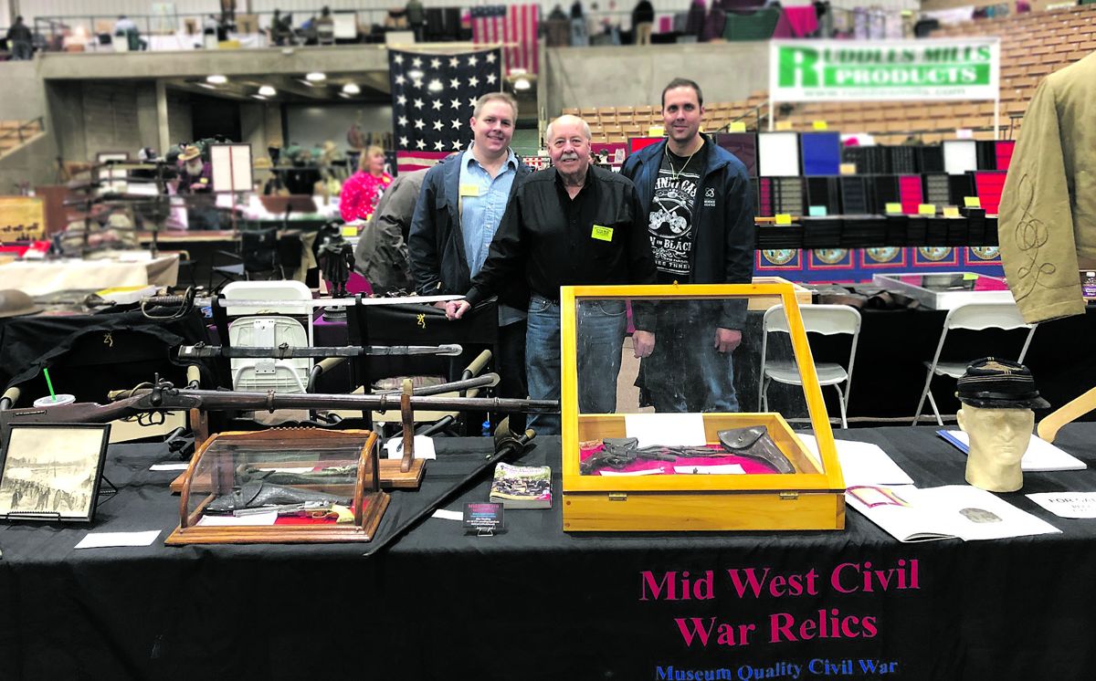 Allen Wandling, Proprietor of Mid West Civil War Relics, stands in the center with his two sons, Michael and Matthew Wandling.