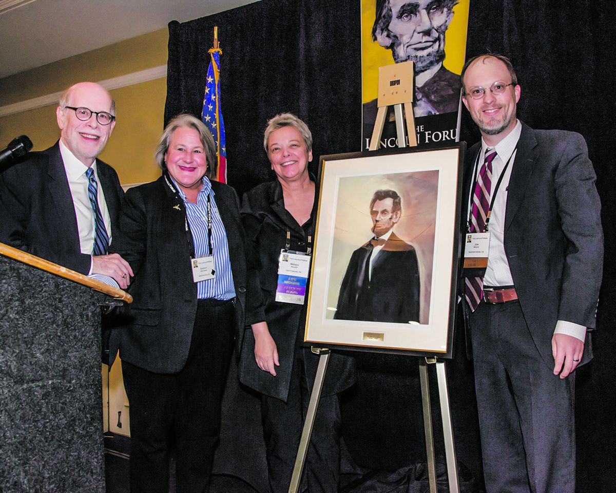 Ceremony for the 2019 Wendy Allen Award for organizational excellence- L to R, Chairman Holzer; award winner Sarah Watson of the Looking for Lincoln coalition; artist Wendy Allen, who created the award; and Vice Chairman White.
