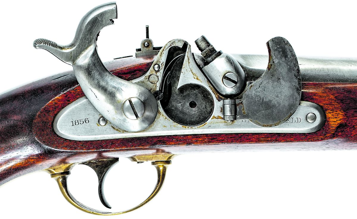 View of the pistol carbine breech area showing the detail of the multi-leaf rear sight, the date on the breech concealed by the sight leaves, and the inspection marks on the angled flat.