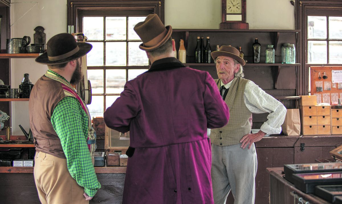 Bill MacIntosh talks to two prospective customers.