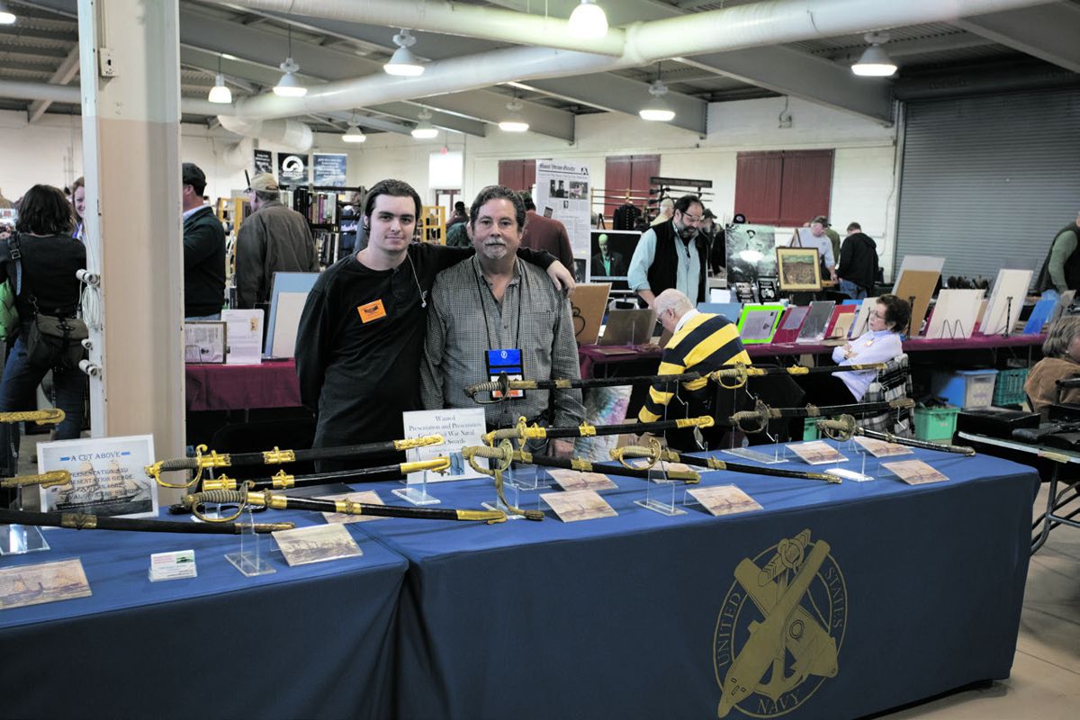 Gerald Roxbury and his grandson Jonathan Bouchard with their award winning display of naval swords.