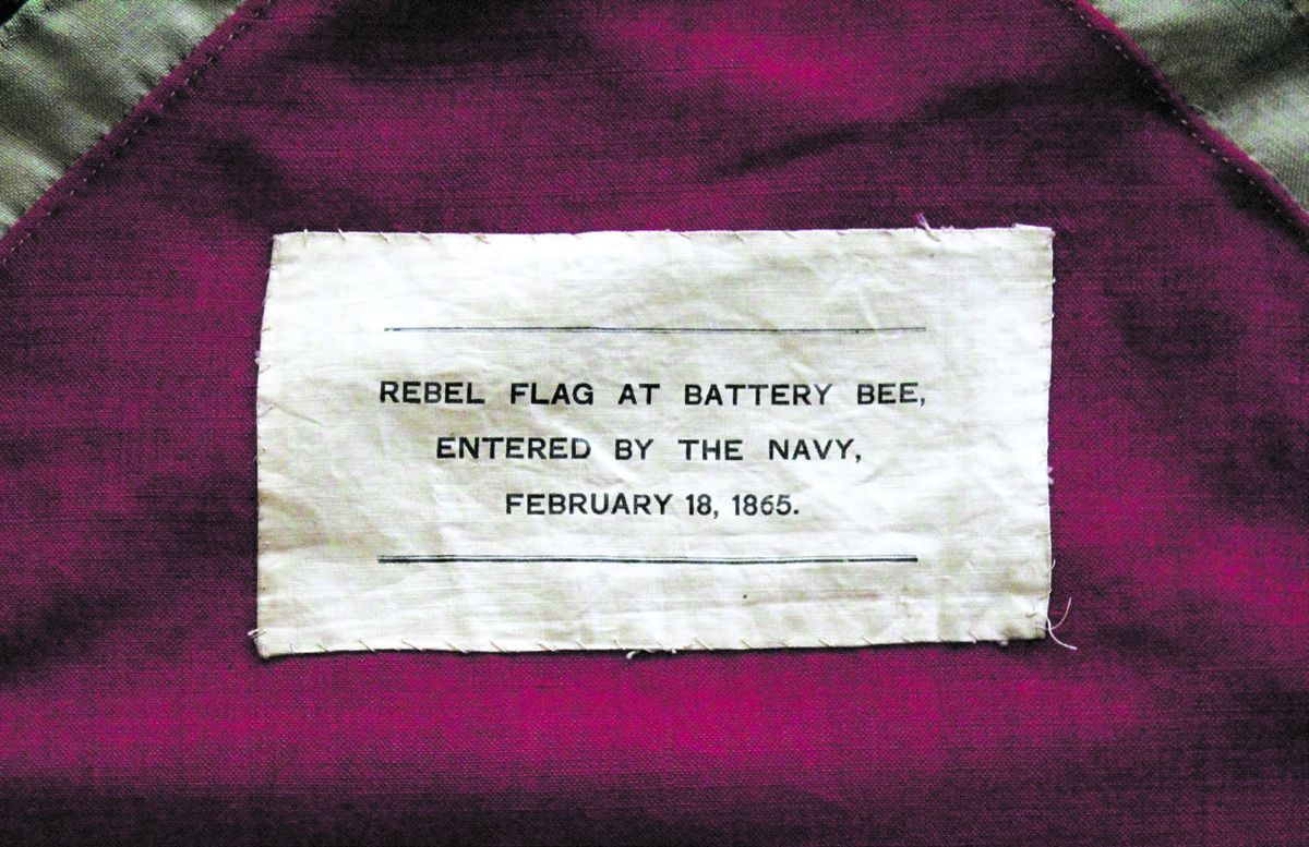 A cotton swatch bearing the flag’s capture history was sewn to the flag’s canton with a whip stitch.