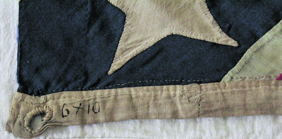 The flag’s maker wrote the flag’s original size on the hoist in ink: 6x10. With damage, the flag is now 7 feet 7 inches.