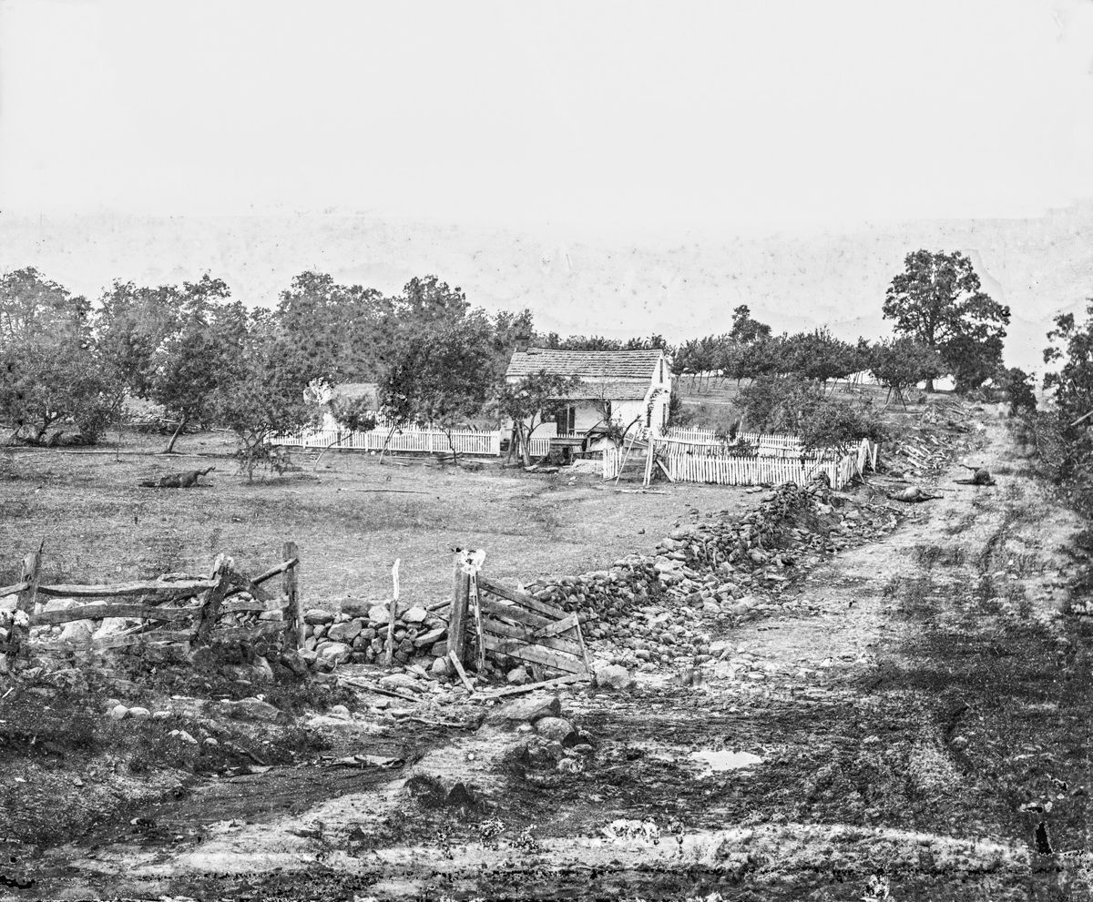 The Leister farm right after the battle. Dead horses are visible on the road and farm. Library of Congress.