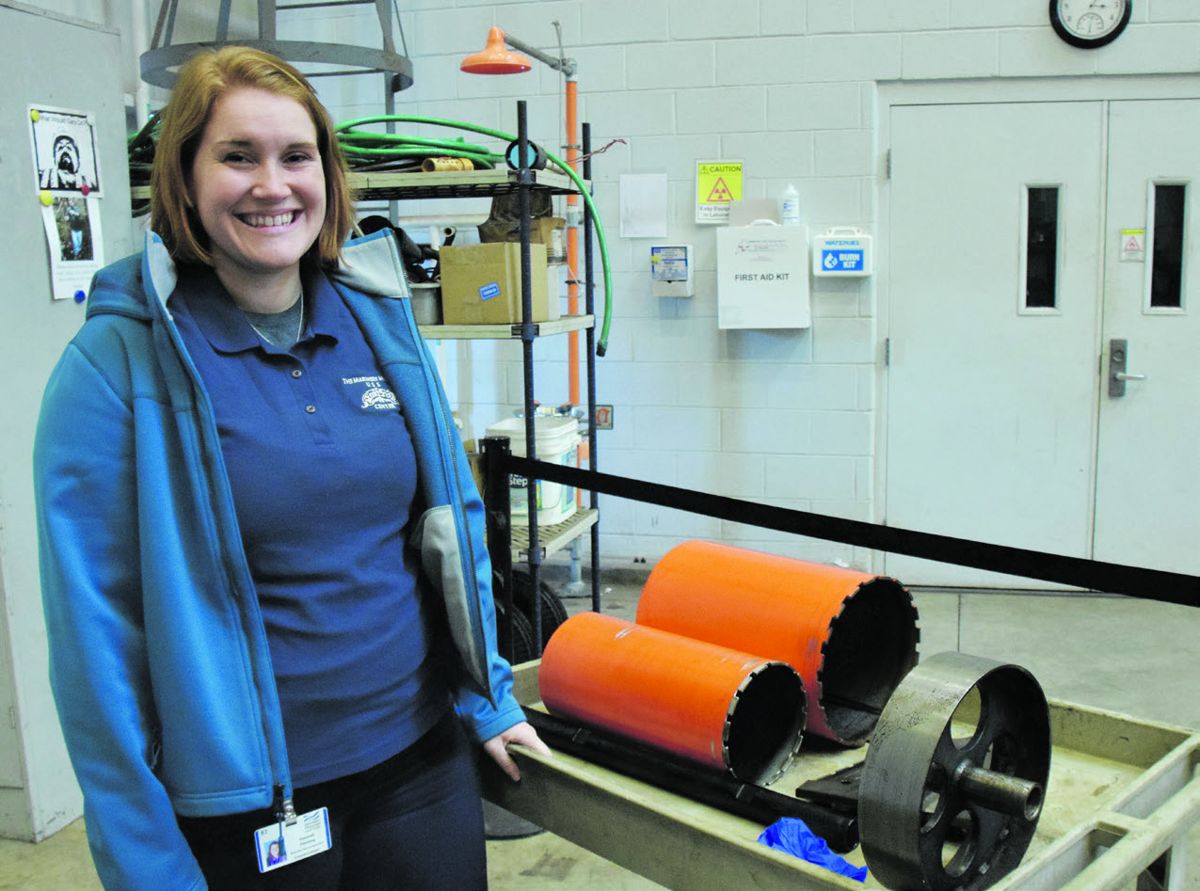 Material Cultural Specialist Hanna Fleming sifted through the concretions removed from the guns during the coring process.