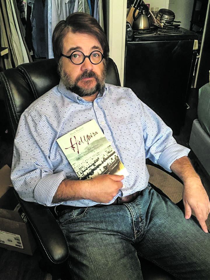 shows off his first book, Hellmira, the latest release in the Emerging Civil War Series.