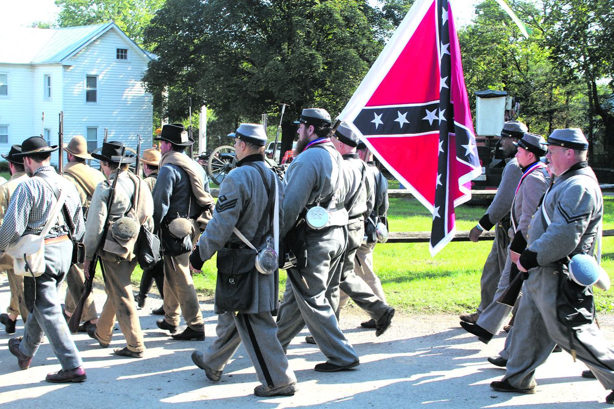 Just as in the past, this Black Confederate (behind the flag) is just a Reb in ranks.
