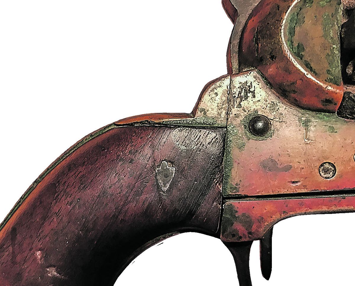 The small silver pinned inset shield or arrowhead was added for an unknown purpose. Southern sporting rifles of the era often had silver inset designs.