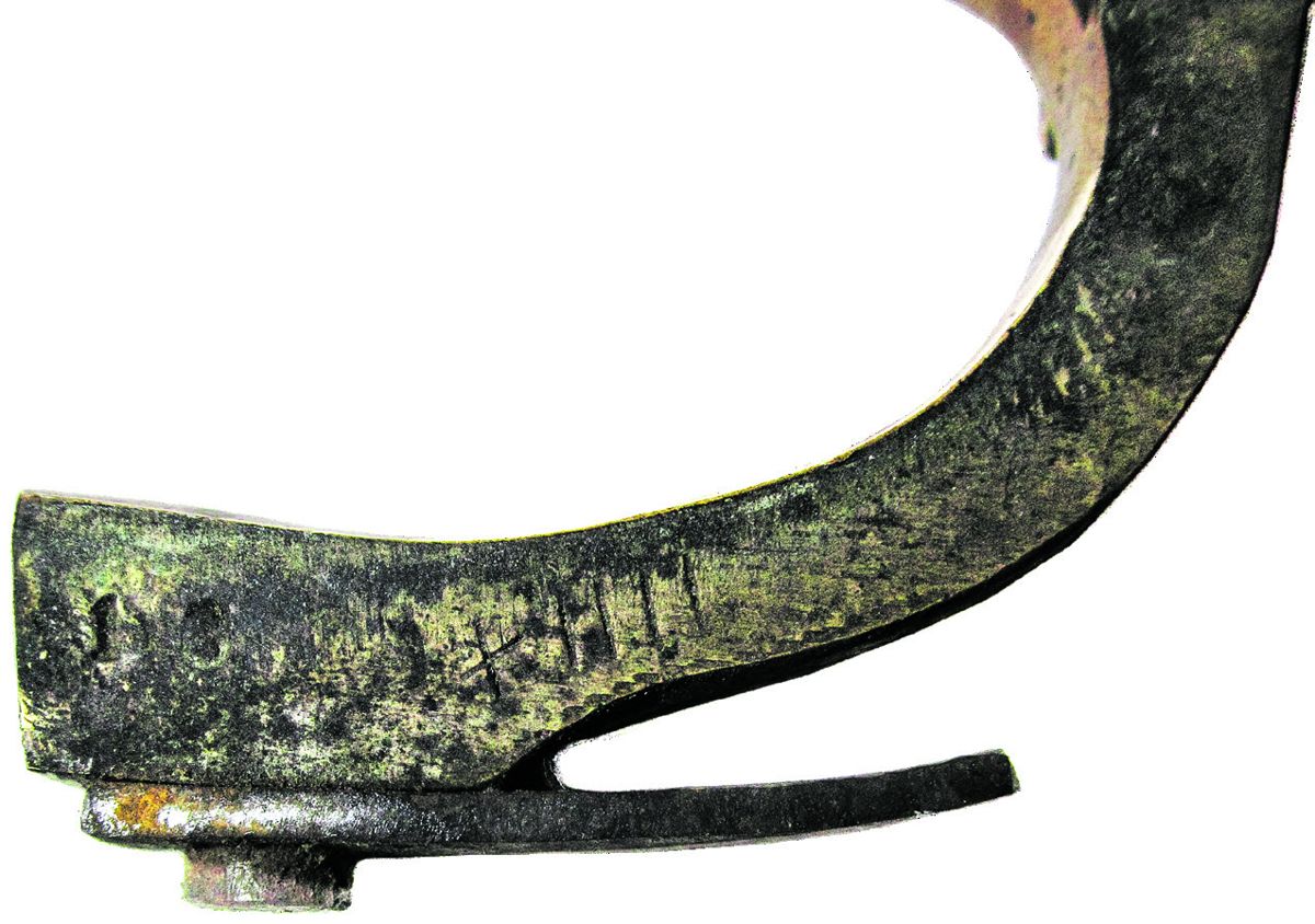 Roman numeral assembly mark, “XIIII,” is found on all 3 parts of revolver that when fitted form the grip frame. Secondary number “13” stamped on trigger guard extension.