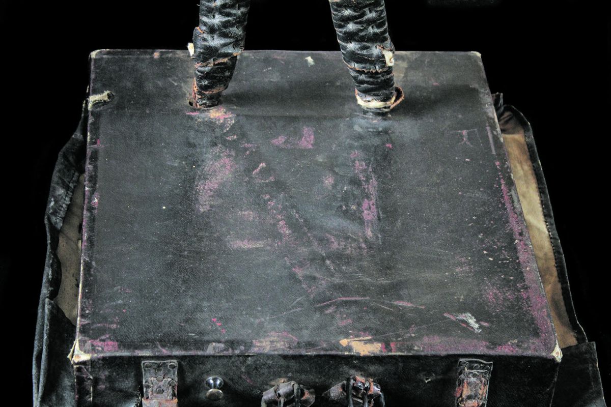 The black painted canvas was initially painted red.
