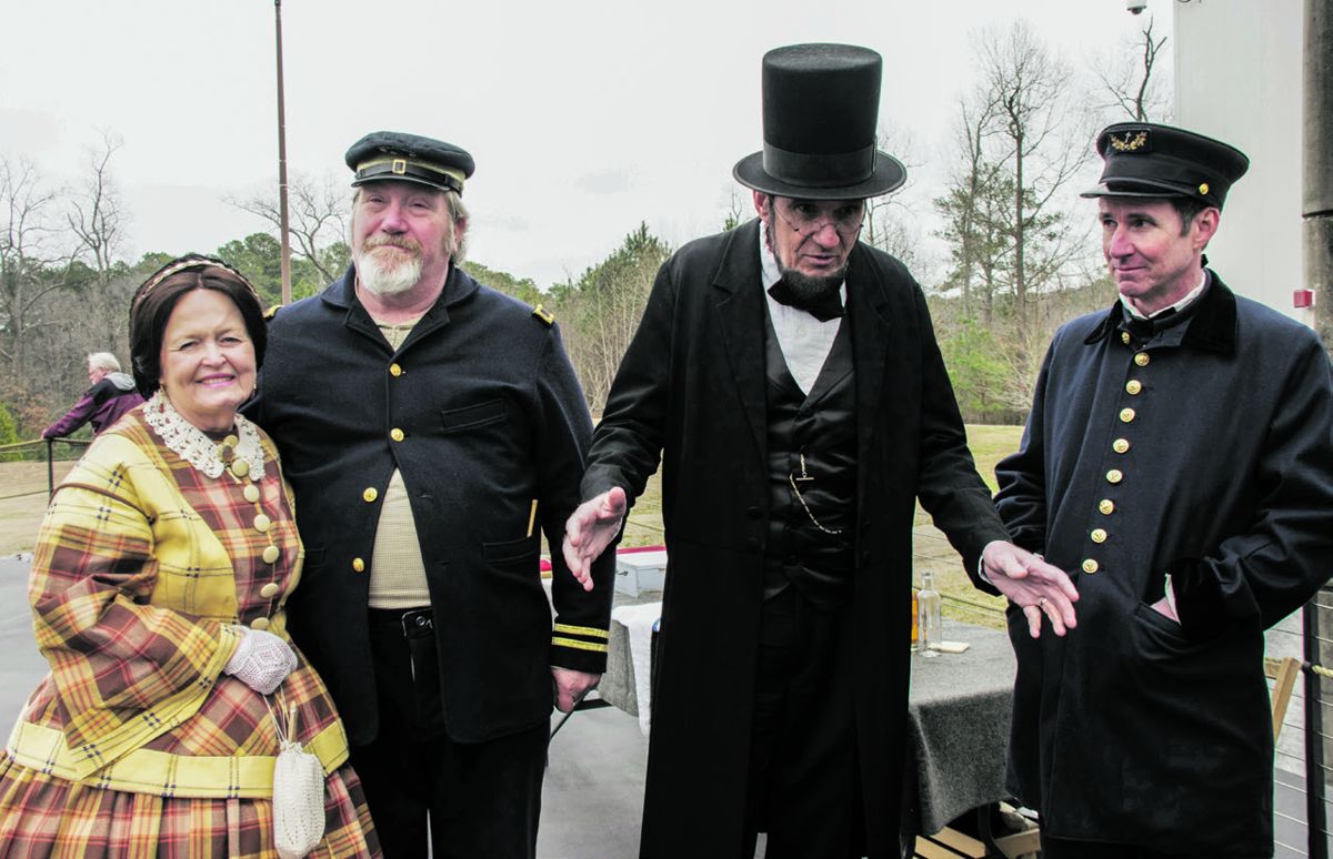 During the Battle of Hampton Roads commemoration at the Mariners’ Museum’s Monitor Center, Mona and George Buss met with Tidewater Maritime Living History members (Allen Mordica and Kurt Eberly) aboard the replica of the USS Monitor.