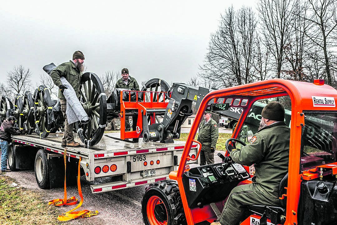 Brian Beeson, uses a forklift to assist other members of the Wilson’s Creek National Battlefield maintenance team unloading reproduction artillery carriages from a flat-bed trailer earlier this year.