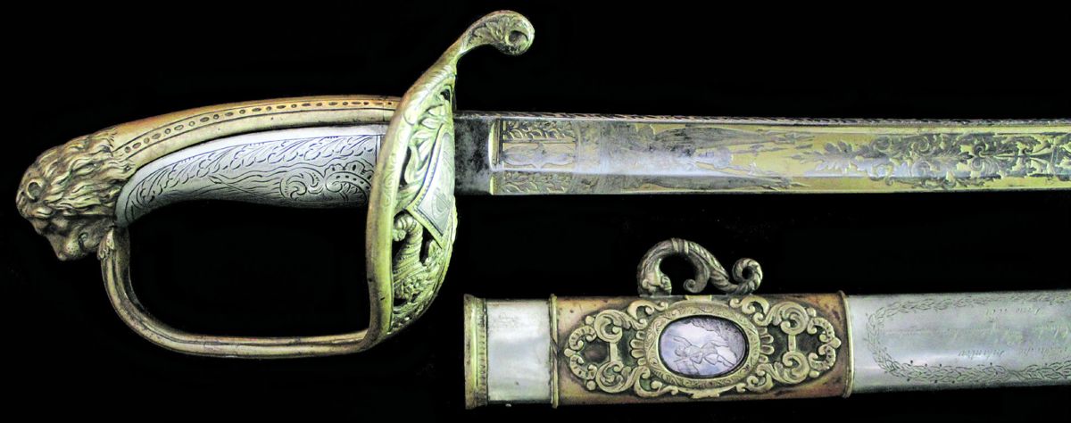 The lion head pommel staff officer’s sword is coin silver mounted, with a gold washed blade.