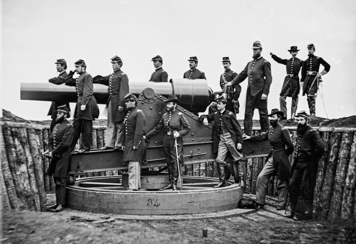 Officers of 3d Regiment Massachusetts Heavy Artillery pose with a 100-pounder Parrott rifle at