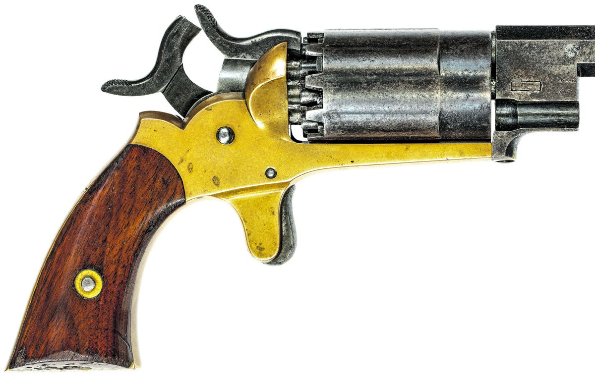 View of a Walch Pocket revolver after the first hammer has been released to fire the front load in the chamber, with the second hammer remaining cocked to fire the rear load.