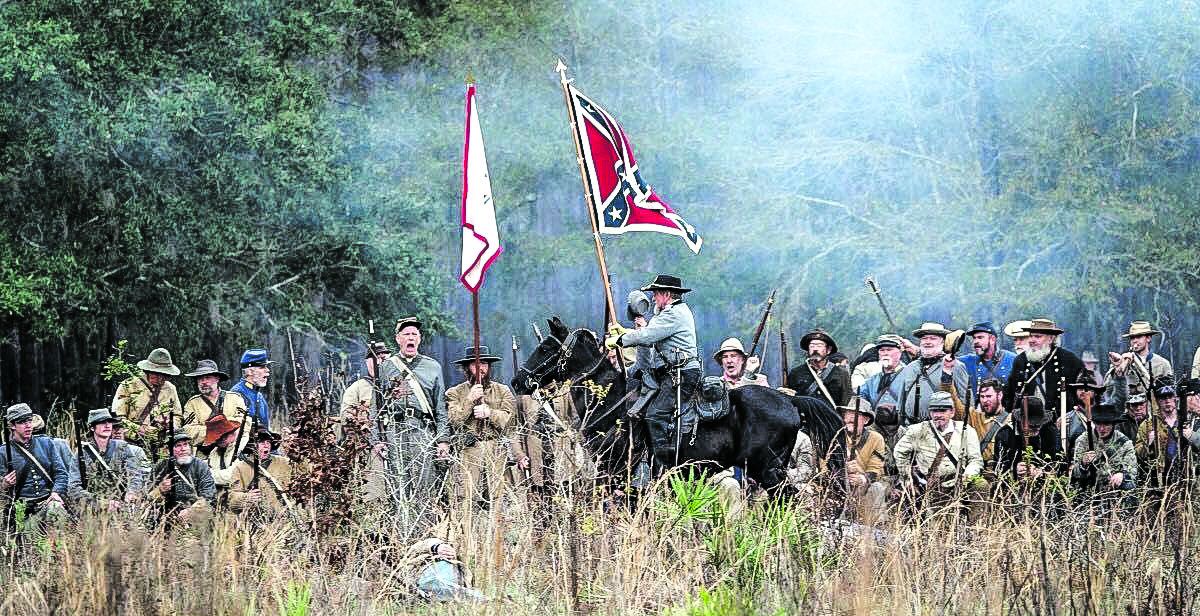 Bud Thayer recreating an actual moment in the battle when a Confederate officer rode his horse furiously up and down the line and rallied the C.S. troops as they were waiting for ammunition. (Olustee Festival photo)
