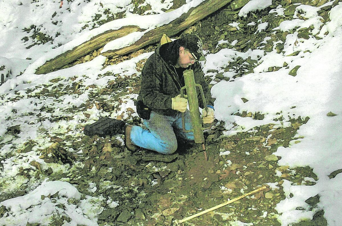 Kem Parada, of Finders Keepers LLC, locates a metal target and is pinpointing his probe to identify location and depth of the target. Kem and his father Dennis are year round treasure hunters. This is a recent photo of Pennsylvania covered in snow.