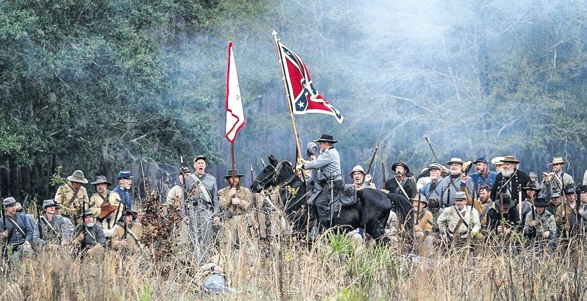 Bud Thayer recreating an actual moment in the battle when a Confederate officer rode his horse furiously up and down the line and rallied the C.S. troops as they were waiting for ammunition. (Olustee Festival photo)