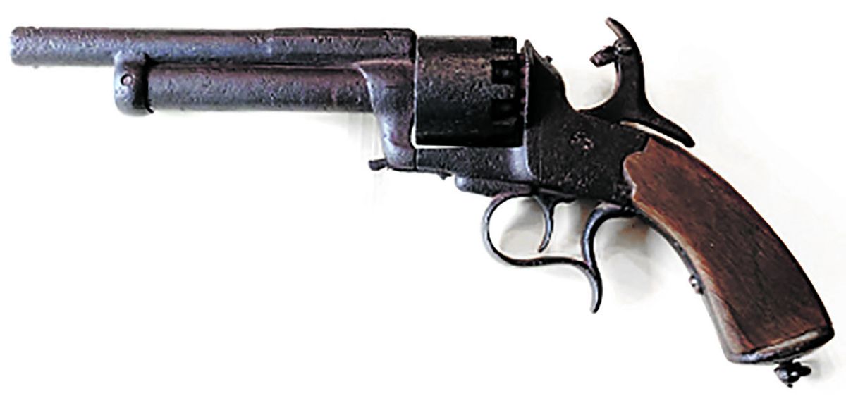 Overall left side cocked with selector on hammer in position to fire shotgun barrel.
