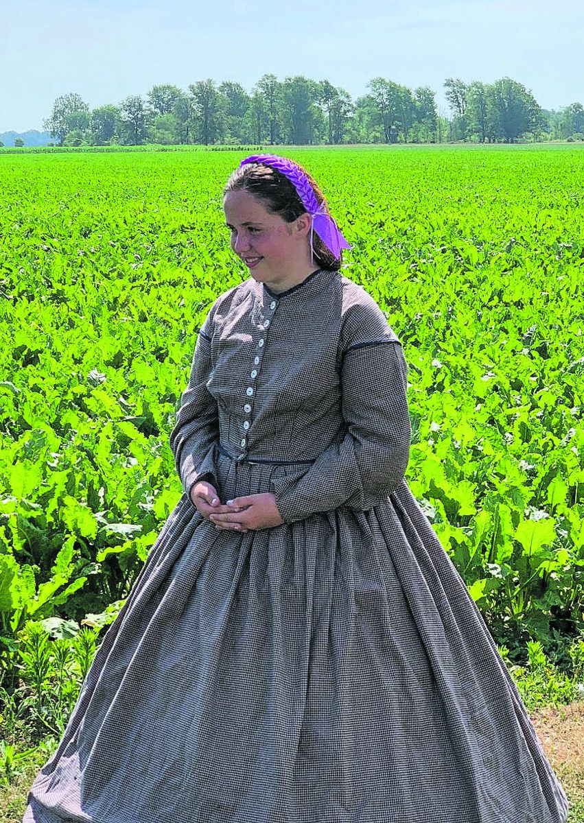 Abigail Lang in period dress during a Living History event.